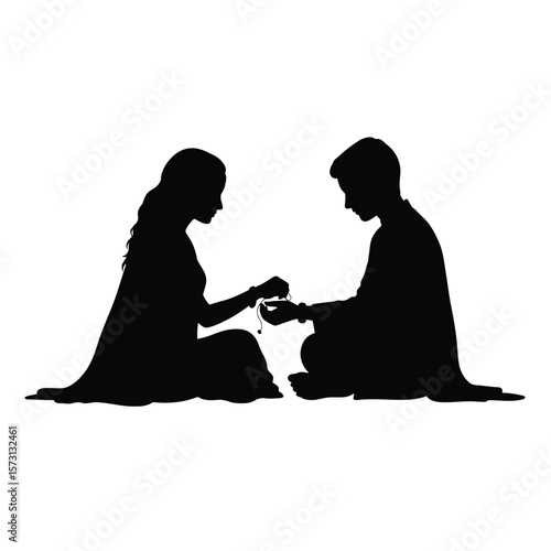 Raksha Bandhan: Silhouette of Brother and Sister Tying Rakhi