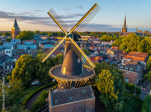 Aerial View of Woerden at Sunset with Historic Dutch Windmill De Windhond and two Churches
