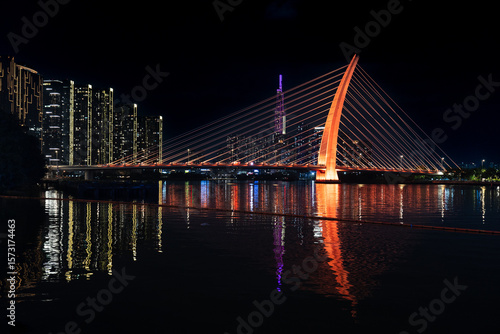 Saigon river and Ba Son Bridge at night in Ho Chi Minh, Vietnam