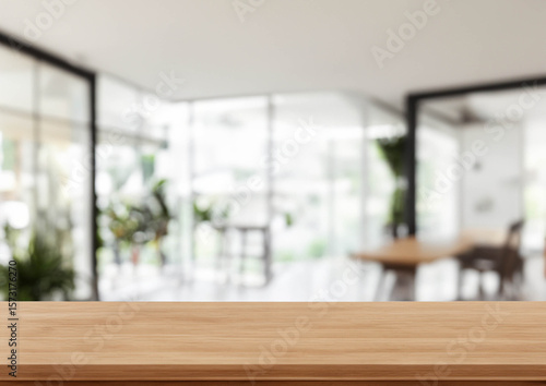 blurry bakground modern office interior with wooden top table