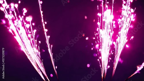 Bright Neon Sparkler Effects Glowing Against Dark Background for Festive Celebrations and Events