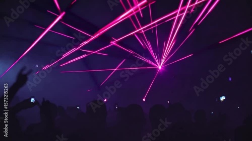 Dynamic Laser Show with Vibrant Pink Lights in a Dark Ambient Nightclub Atmosphere