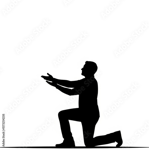 Silhouette of Man Kneeling with Hands Up