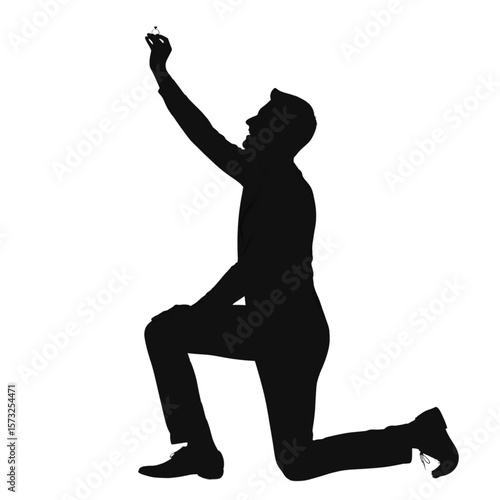 Silhouette of a Man Proposing with Engagement Ring