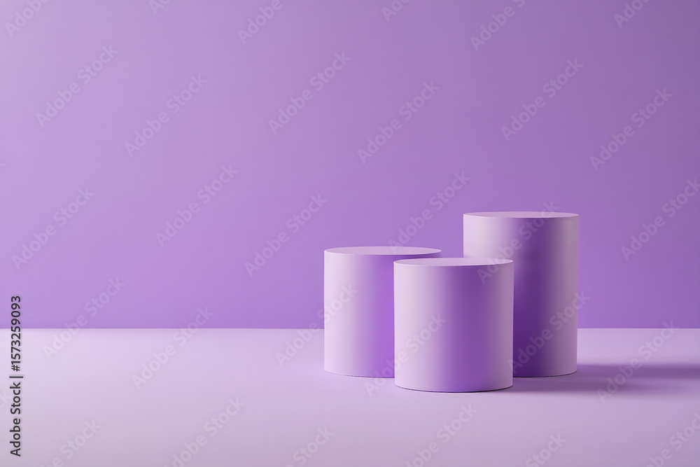Three pastel purple cylinders stand on a matching purple background Three pastel purple cylinders stand on a matching purple background