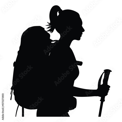Woman hiker with backpack and trekking poles silhouette