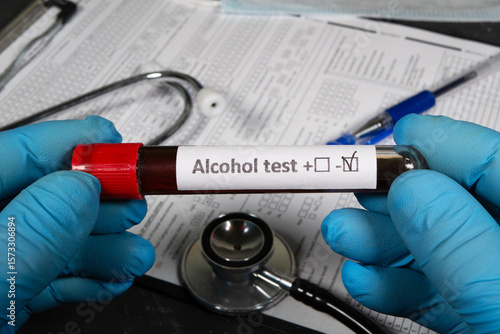 Doctor holding blood sample for alcohol test: negative result