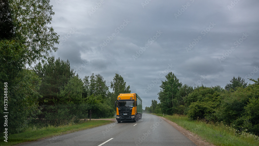 custom made wallpaper toronto digitalYellow truck on a country road on a cloudy summer day.