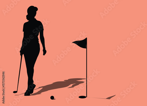 Golfer walking on the green towards the hole with putter