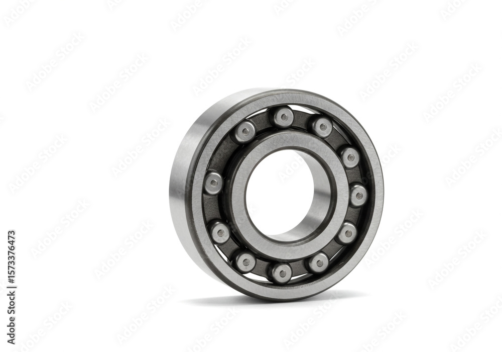 Close up view of a metal ball bearing with visible ball bearings on a plain white background Close up view of a metal ball bearing with visible ball bearings on a plain white background