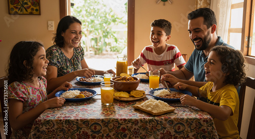 Family Enjoys Traditional Brazilian National Bean Day Feast Together Around Dining Table With Juice And Food
