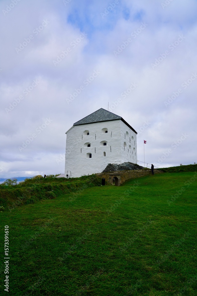Historic white fortress on a green hill in Trondheim. Historic white fortress on a green hill in Trondheim.