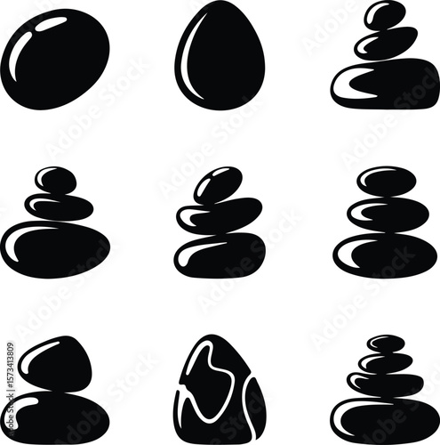 Black smooth stones stacked and isolated on white background 1