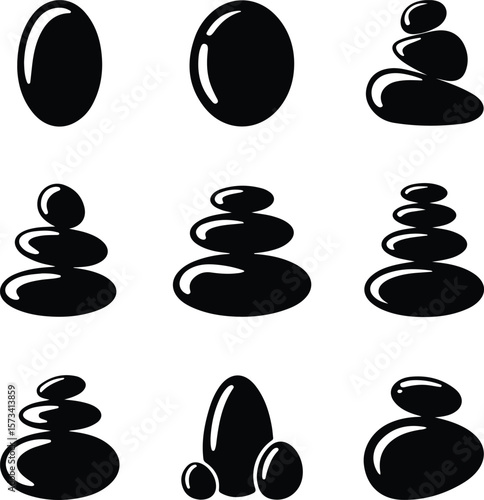 Black smooth stones stacked and isolated on white background