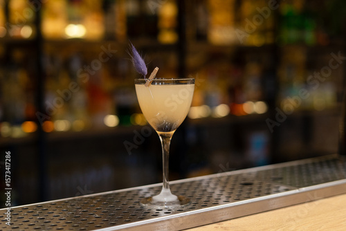 sour cocktail drink with ice cubes. Pisco sour alcohol cocktail on blur background surface.