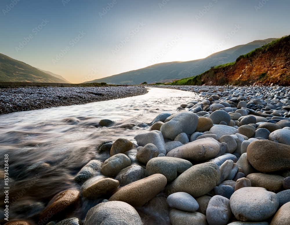 Obraz premium close up shot of pebbles and stones on a riverbed shaped by the gentle passage of water through the ages