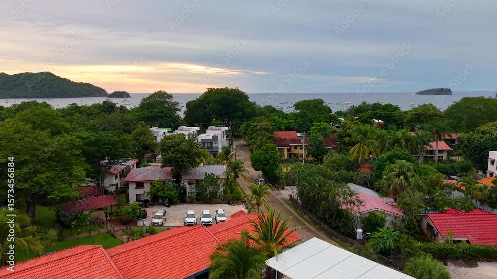 Aerial footage of Playas del Coco, Costa Rica — golden beaches, lush hills, and a scenic bay filled with yachts, perfect for tourism, ocean adventures, and tropical getaways