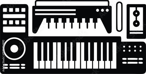 Photo of a collection of electronic music production equipment including a synthesizer and speakers