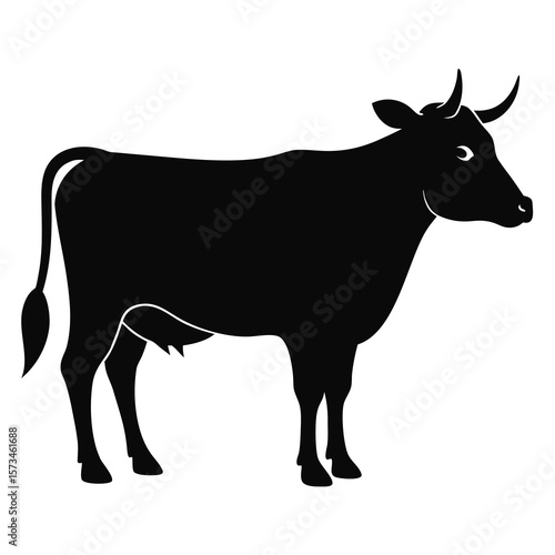 A black silhouette of a cow standing with horns and a tail isolated on white background silhouette