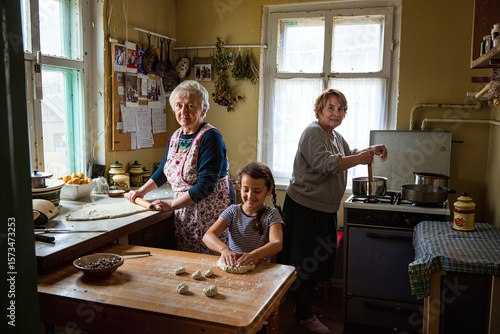 family cooking and doing lessons in kitchen
