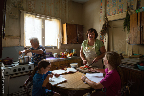 family cooking and doing lessons in kitchen