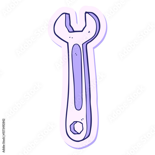 sticker of a cartoon spanner in bright neon color