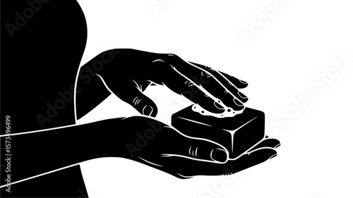 Hands delicately hold and press a small, decorated box, showcasing a moment of care, precision, and potential anticipation.