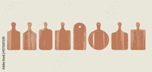Collection of various wooden cutting boards with handles arranged in a row