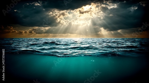 Ocean split, dramatic sky, sunlight beams