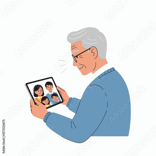 An elderly man smiles while video calling his family on a tablet