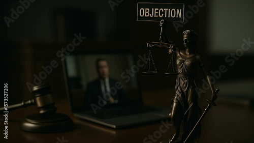 Courtroom Objection: A symbol of justice stands in the dimly lit courtroom, where a legal proceeding unfolds on a laptop screen, punctuated by an objection sign.