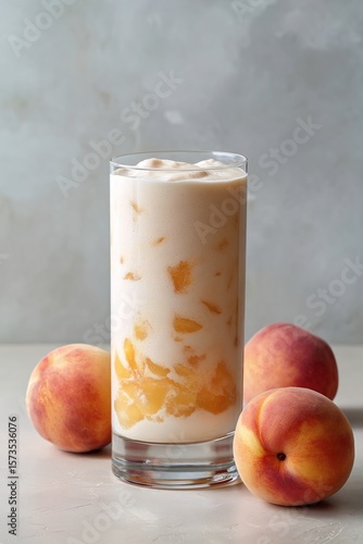 Peach Cream Latte or Affogato in Clear Glass – Fresh Summer Drink with Peach Slices

