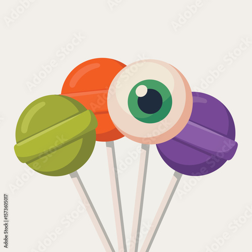 Four colorful lollipops including one shaped like an eyeball for halloween