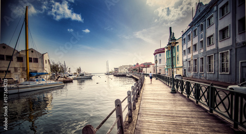 Woman strolls down the Boardwalk in Bridgetown Barbados