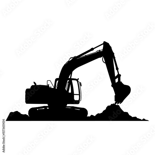 Silhouette of an excavator digging into a pile of earth, construction site.