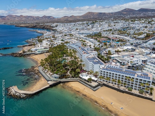 Fotografie Aerial view of Puerto del Carmen, Lanzarote, showcasing coastal buildings and cl