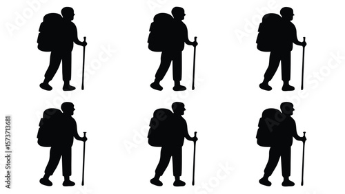 Backpackers with walking sticks silhouette hiking