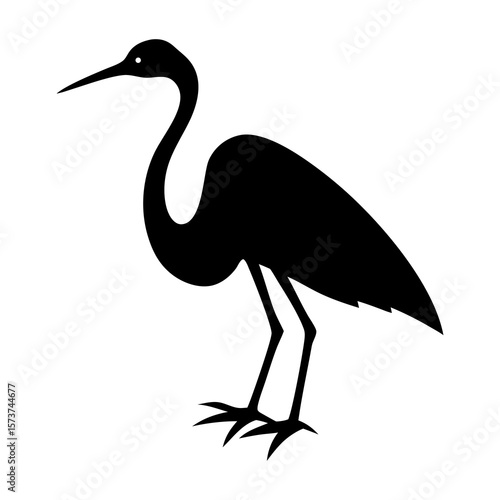 Silhouette of a graceful heron standing with its long neck curved and pointed beak
