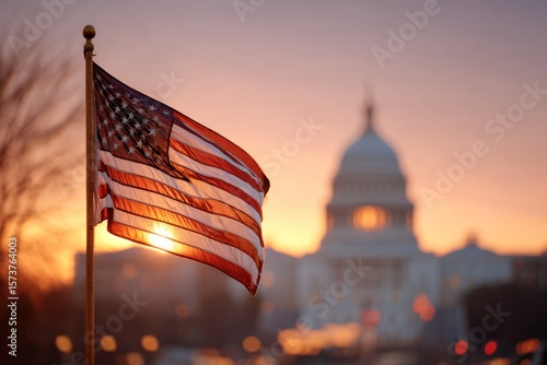 American flag waving at sunrise over Capitol building