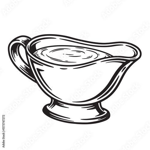 Black and white vintage gravy boat filled with gravy sauce on white background