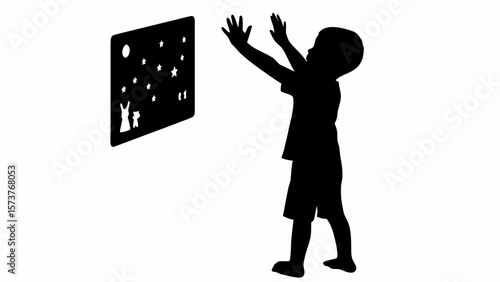 Silhouette of a child reaching towards a wall decoration with stars moon and animal cutouts visible on it