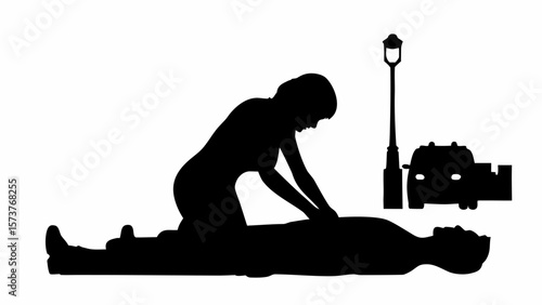 Silhouette of woman performing cpr on a man with a vehicle and street light in the background scene outdoors