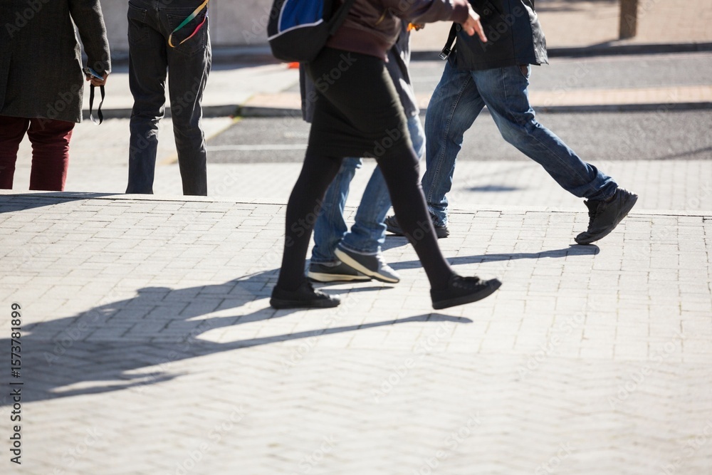 Obraz premium People walking on sidewalk