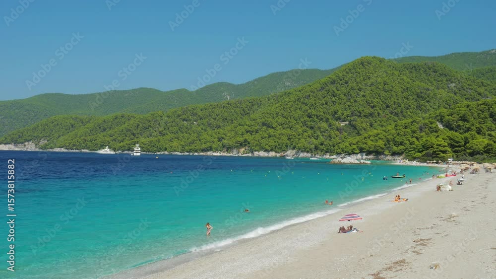 Skopelos, Greece - August 25, 2018: The amazing Milia beach on Skopelos island in Greece Skopelos, Greece - August 25, 2018: The amazing Milia beach on Skopelos island in Greece