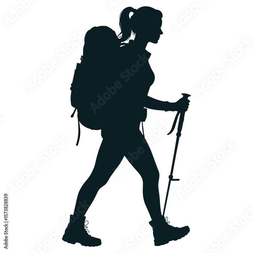 Woman hiker with backpack and trekking pole walking silhouette