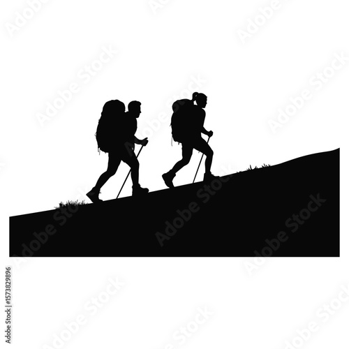 Two hikers with backpacks and poles climbing a hill silhouette