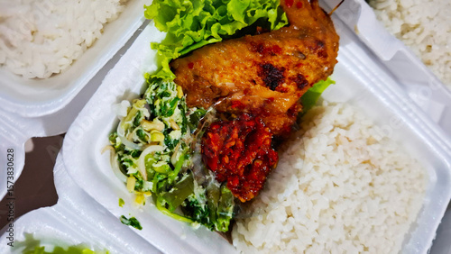 Wallpaper Mural lunch box catering with a menu of grilled spicy chicken wings with rice Torontodigital.ca