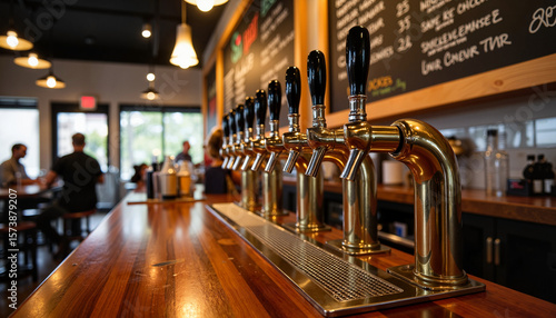 Vintage beer taps and chalkboard menu in modern brewery, craft ambiance