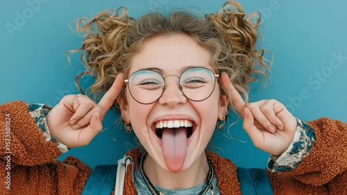 Adolescent hipster girl grabbing her head and pulling faces