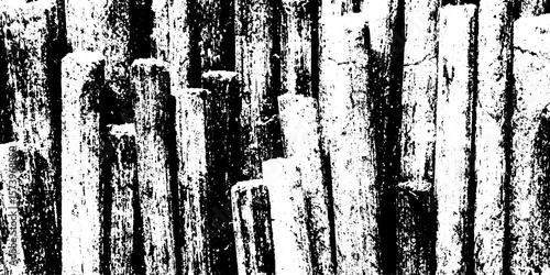 Grungy burnt matchstick bundle with charred tips and distressed wood texture